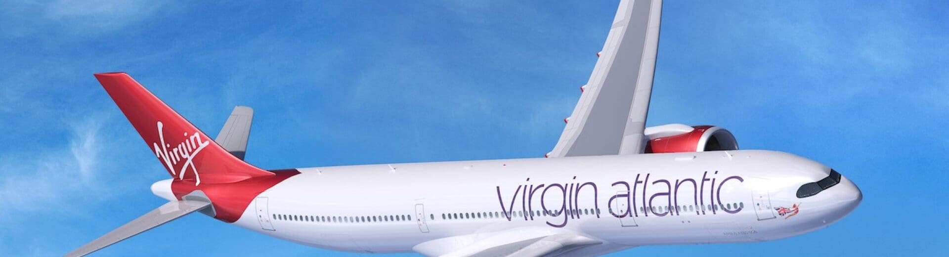 a white and red airplane flying in the sky