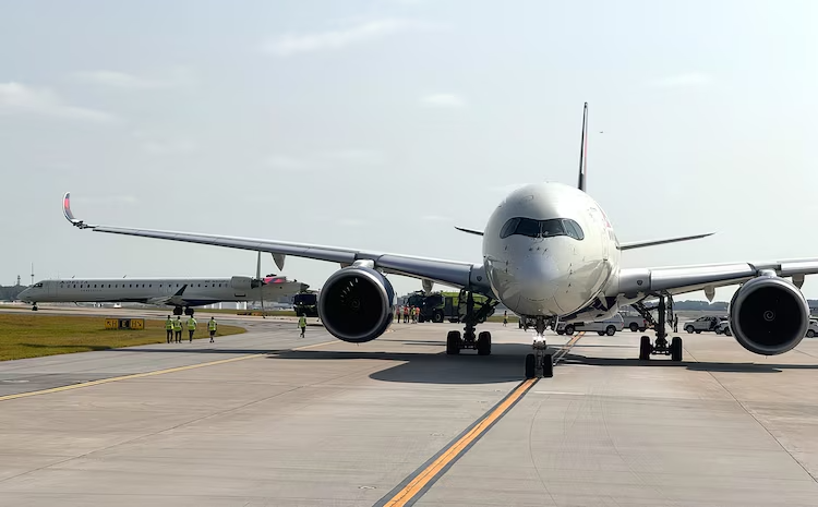 a large white airplane on a runway