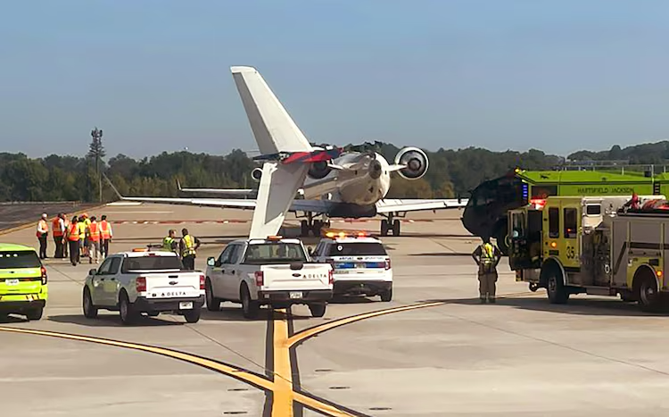 a plane and ambulances on a runway