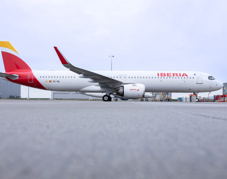 a large white airplane on a runway