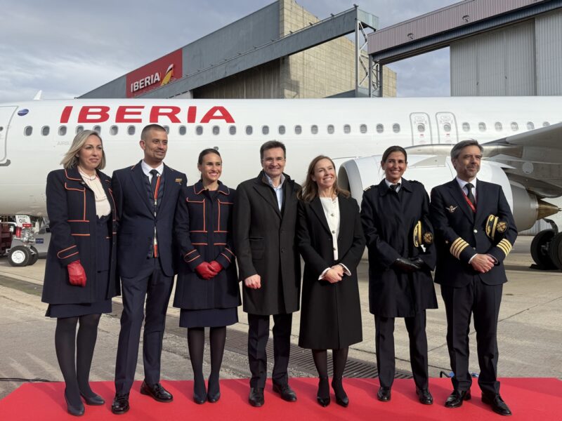 a group of people standing on a red carpet