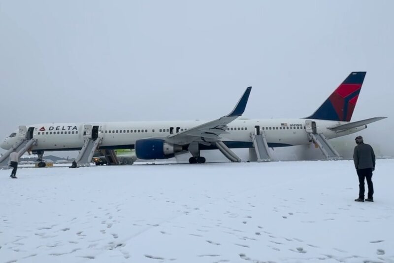 a plane parked on a snowy runway