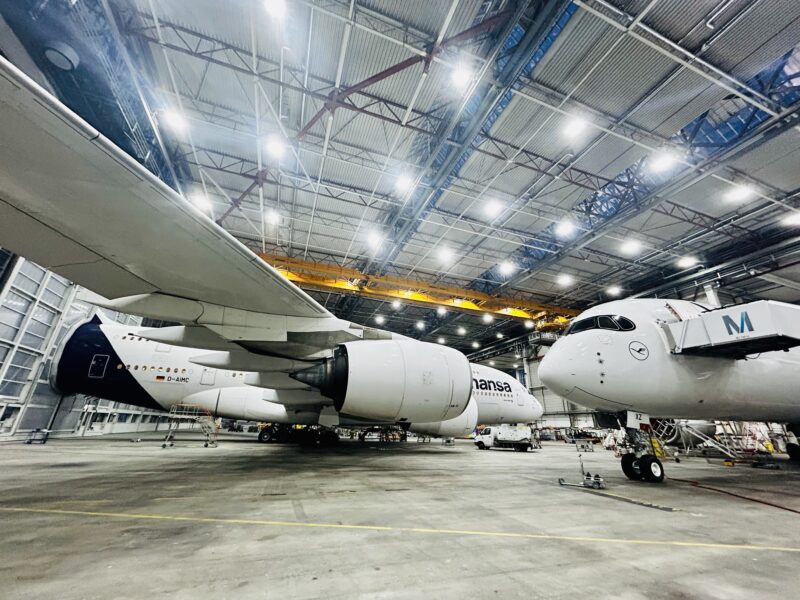 a large hangar with airplanes