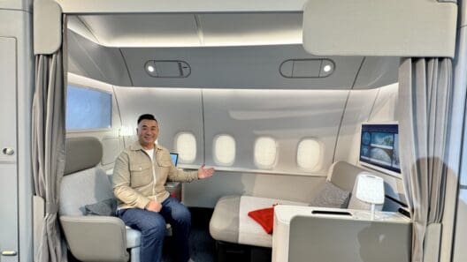 a man sitting in a chair in a plane
