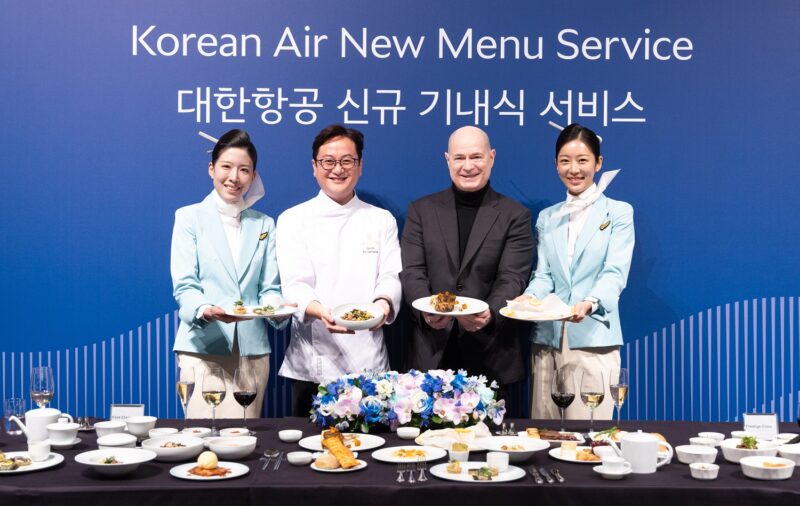 a group of people holding plates of food