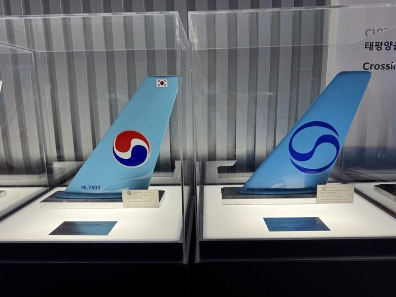 a blue tail fin of an airplane in a case