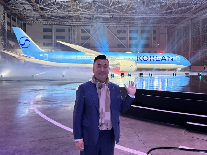 a man standing in front of an airplane