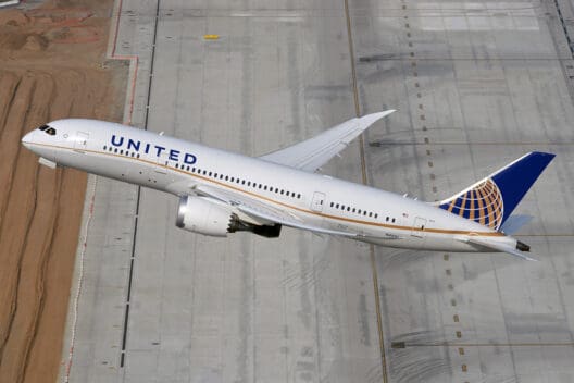 a plane flying over a runway