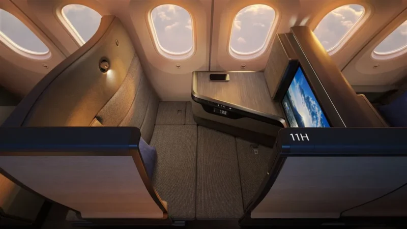 the inside of an airplane with a television and windows