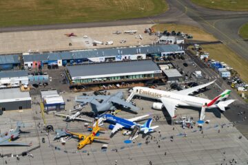 an aerial view of airplanes and buildings