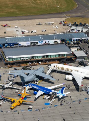 an aerial view of airplanes and buildings