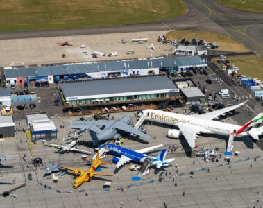 an aerial view of airplanes and buildings