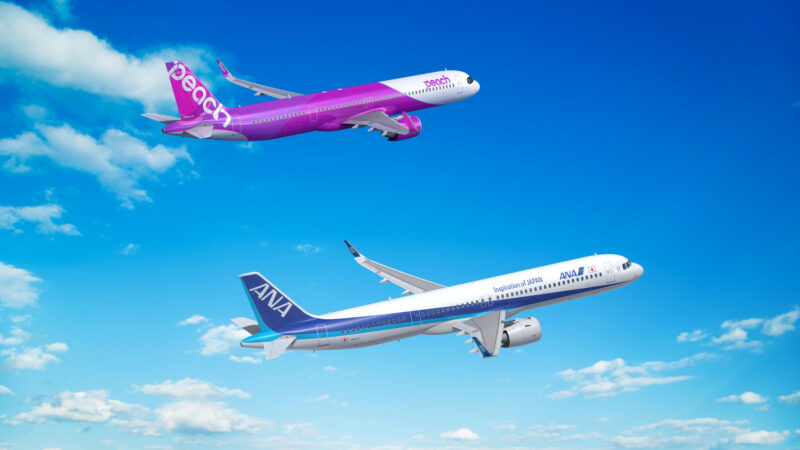 two airplanes flying in the sky