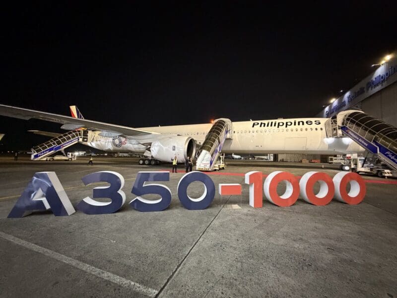 a large airplane with stairs up to the side