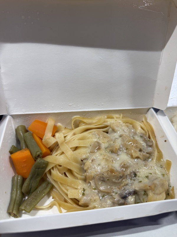 a box of noodles and vegetables