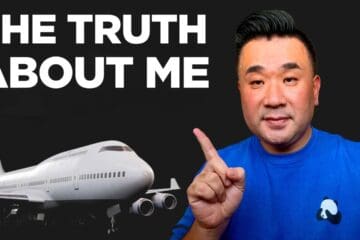 a man pointing his finger in front of a plane